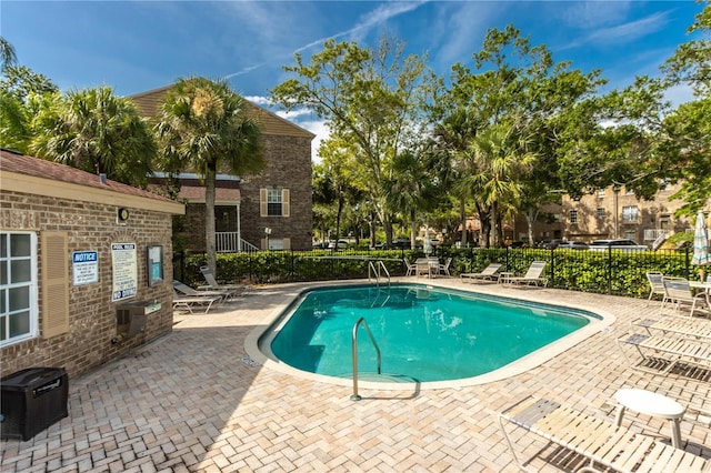 4117 Daventry Ln, Palm Harbor, FL 34685 - community pool featuring a patio