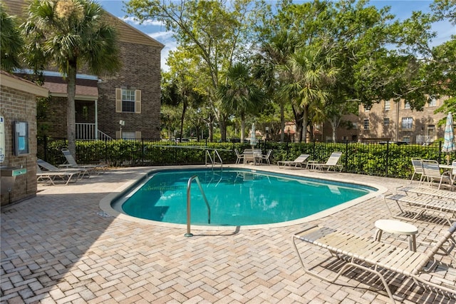 4117 Daventry Ln, Palm Harbor, FL 34685 - community pool featuring a patio