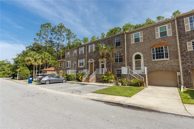 4117 Daventry Ln, Palm Harbor, FL 34685 - view of property with a garage and brick siding