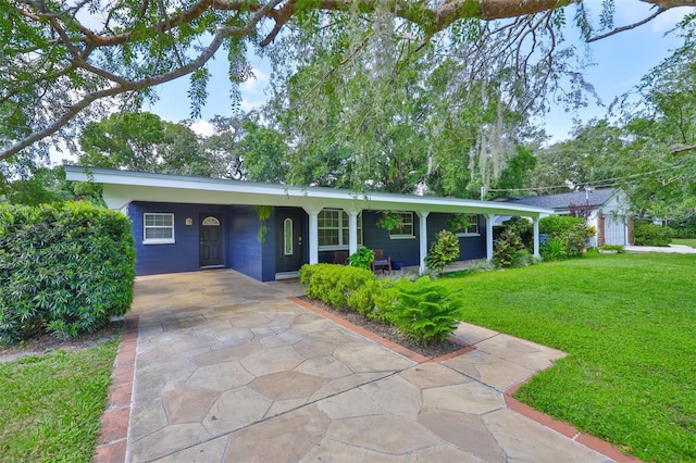 1708 Pond Lake Dr, Tampa, FL 33612 - ranch-style home with concrete driveway, a front yard, and a carport