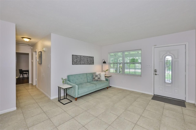 1708 Pond Lake Dr, Tampa, FL 33612 - foyer featuring light tile patterned floors and baseboards