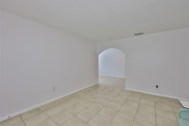 1708 Pond Lake Dr, Tampa, FL 33612 - spare room with arched walkways and baseboards