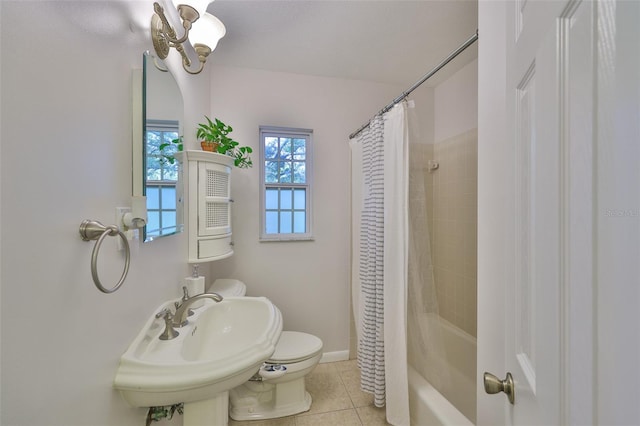 1708 Pond Lake Dr, Tampa, FL 33612 - full bath with tile patterned flooring, shower / bath combo with shower curtain, and a chandelier