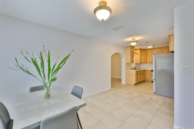 1708 Pond Lake Dr, Tampa, FL 33612 - unfurnished dining area with arched walkways and light tile patterned floors