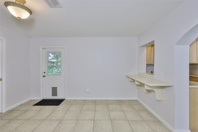 1708 Pond Lake Dr, Tampa, FL 33612 - entryway with light tile patterned floors and arched walkways