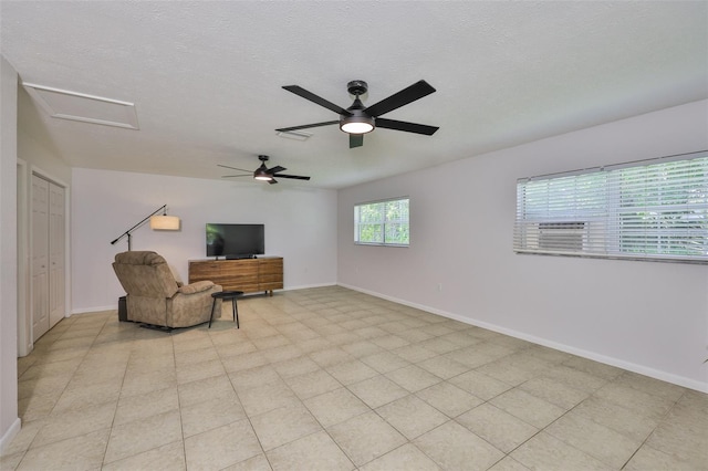 1708 Pond Lake Dr, Tampa, FL 33612 - unfurnished room featuring attic access, ceiling fan, and a textured ceiling