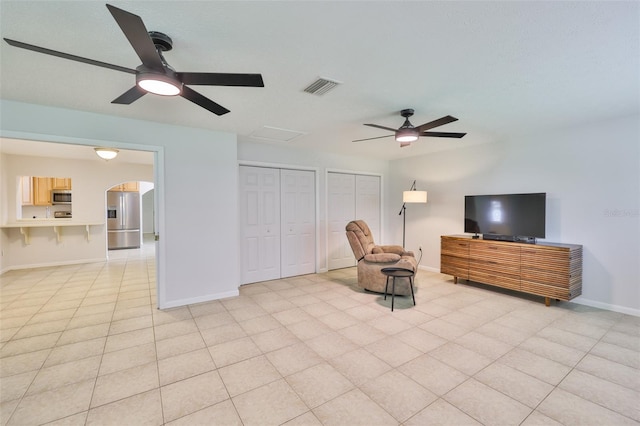 1708 Pond Lake Dr, Tampa, FL 33612 - living area featuring ceiling fan and arched walkways