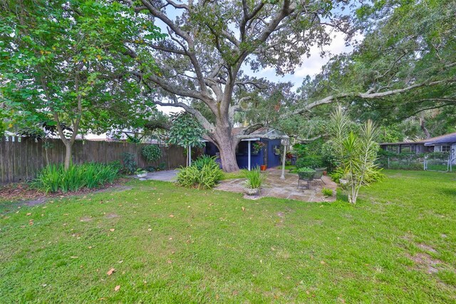 1708 Pond Lake Dr, Tampa, FL 33612 - fenced yard featuring a patio