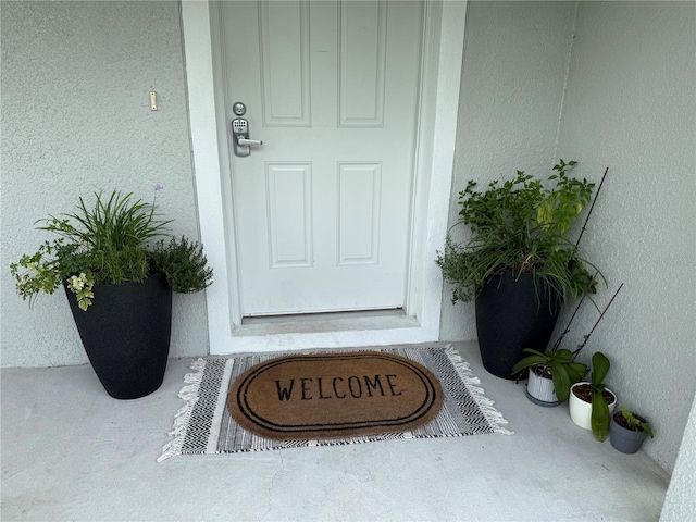 6270 Airmont Dr, Spring Hill, FL 34606 - entrance to property featuring stucco siding