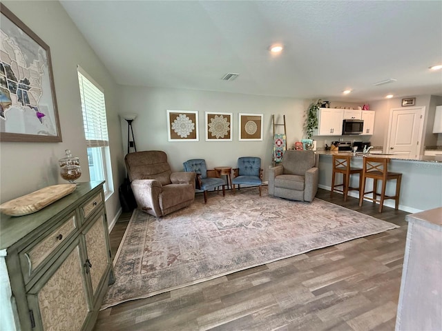 6270 Airmont Dr, Spring Hill, FL 34606 - living room with dark wood-style floors and recessed lighting