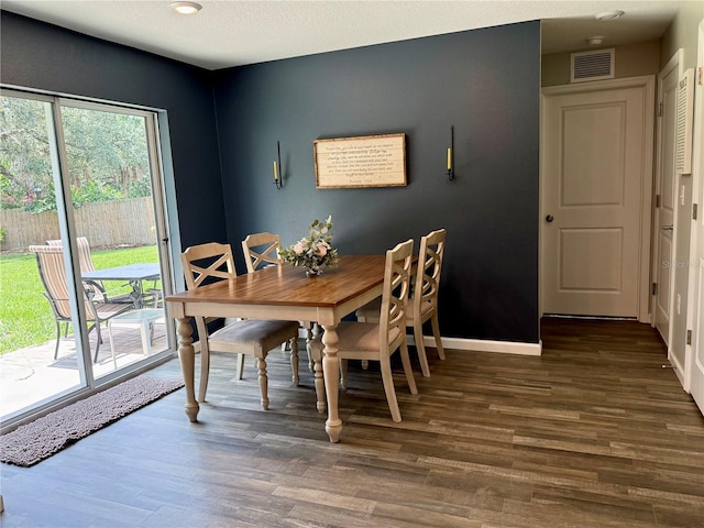 6270 Airmont Dr, Spring Hill, FL 34606 - dining space featuring dark wood finished floors