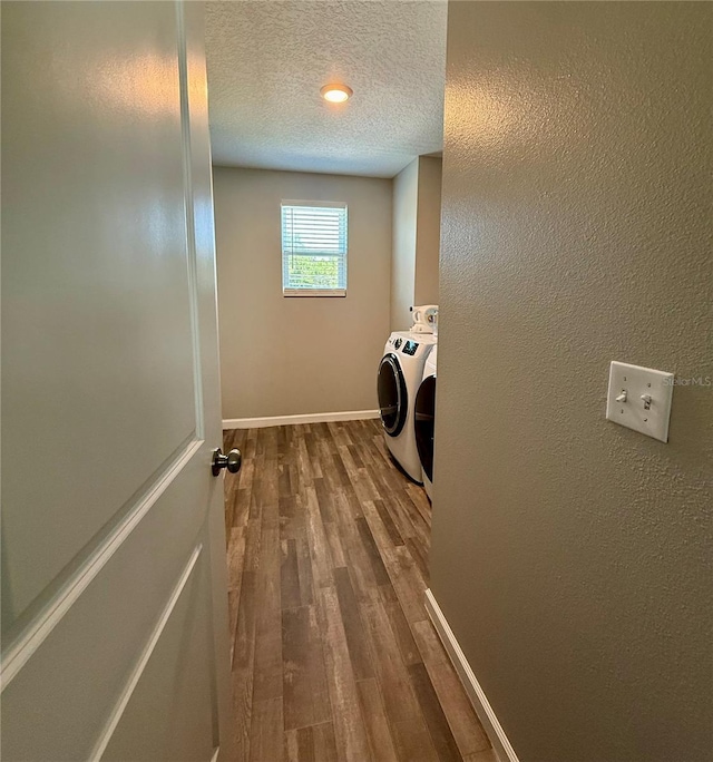 6270 Airmont Dr, Spring Hill, FL 34606 - washroom with independent washer and dryer, a textured ceiling, and dark wood-type flooring