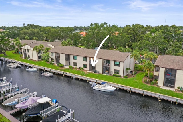 358 Moorings Cove Dr Unit 4B, Tarpon Springs, FL 34689 - aerial view of residential area with a large body of water and a tree filled landscape