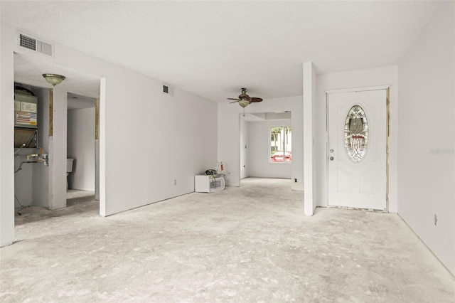358 Moorings Cove Dr Unit 4B, Tarpon Springs, FL 34689 - unfurnished living room featuring a ceiling fan