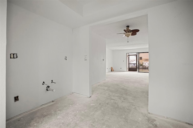 358 Moorings Cove Dr Unit 4B, Tarpon Springs, FL 34689 - empty room featuring a ceiling fan and unfinished concrete floors
