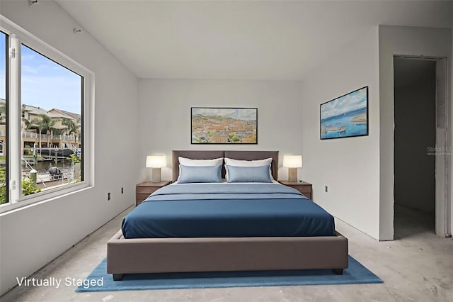 358 Moorings Cove Dr Unit 4B, Tarpon Springs, FL 34689 - bedroom with unfinished concrete flooring