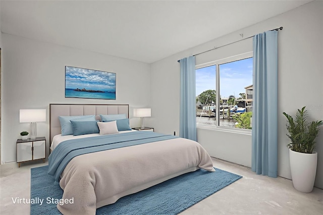 358 Moorings Cove Dr Unit 4B, Tarpon Springs, FL 34689 - bedroom with unfinished concrete floors