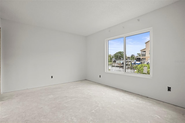 358 Moorings Cove Dr Unit 4B, Tarpon Springs, FL 34689 - spare room with concrete flooring