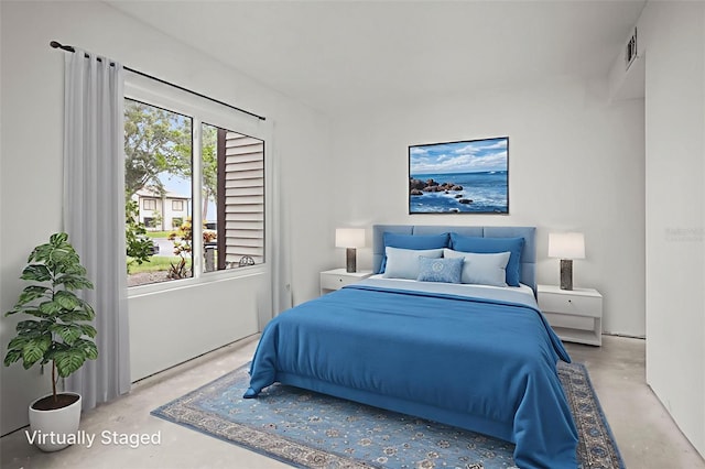 358 Moorings Cove Dr Unit 4B, Tarpon Springs, FL 34689 - bedroom featuring concrete flooring and multiple windows