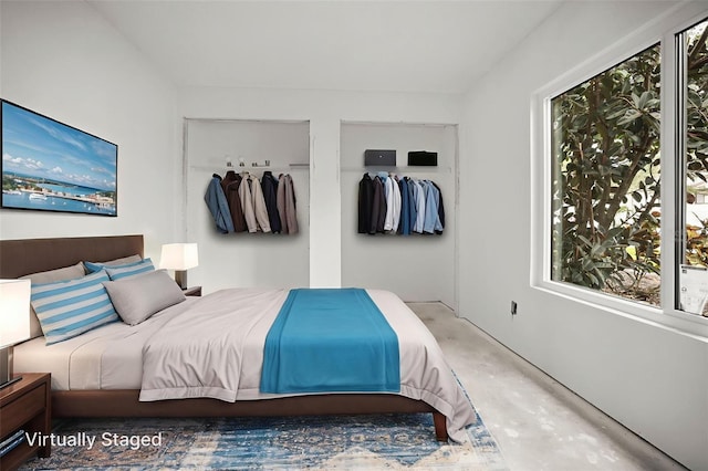 358 Moorings Cove Dr Unit 4B, Tarpon Springs, FL 34689 - bedroom featuring concrete flooring