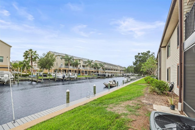 358 Moorings Cove Dr Unit 4B, Tarpon Springs, FL 34689 - water view featuring a boat dock and nearby suburban area