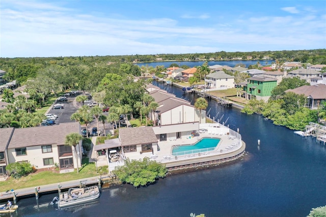 358 Moorings Cove Dr Unit 4B, Tarpon Springs, FL 34689 - aerial perspective of suburban area with a large body of water