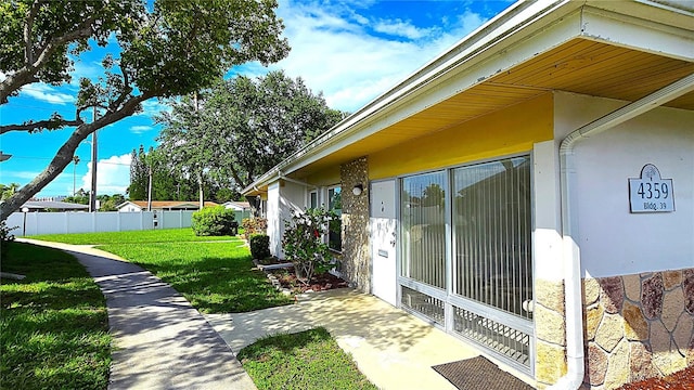 4359 Tahitian Gardens Cir Unit A, Holiday, FL 34691 - view of side of home with stucco siding