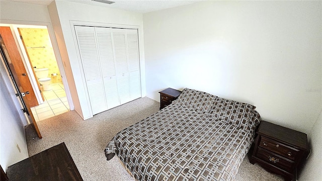 4359 Tahitian Gardens Cir Unit A, Holiday, FL 34691 - bedroom with carpet floors and a closet