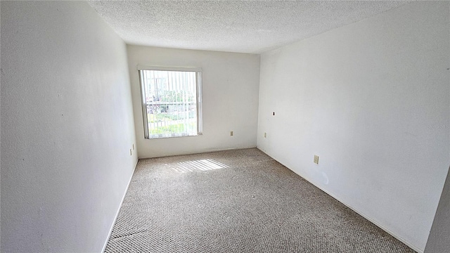 4359 Tahitian Gardens Cir Unit A, Holiday, FL 34691 - carpeted spare room with a textured ceiling