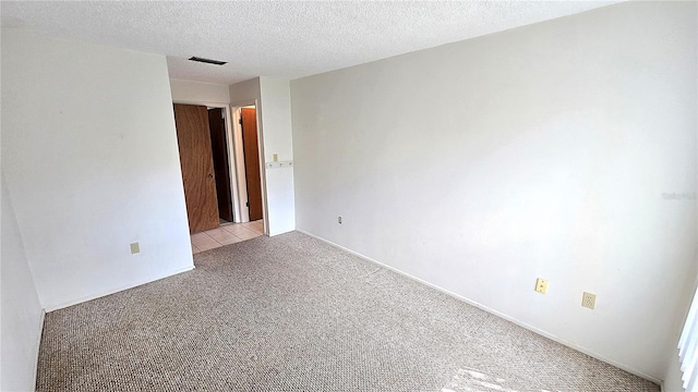 4359 Tahitian Gardens Cir Unit A, Holiday, FL 34691 - spare room featuring light carpet and a textured ceiling
