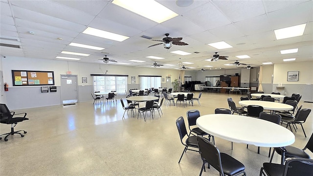 4359 Tahitian Gardens Cir Unit A, Holiday, FL 34691 - dining room featuring a ceiling fan and a paneled ceiling