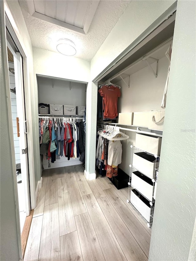 713 Rustic Oaks Dr, Palm Harbor, FL 34684 - spacious closet with wood finished floors