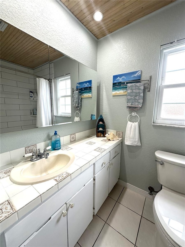 713 Rustic Oaks Dr, Palm Harbor, FL 34684 - bathroom with wooden ceiling, a textured wall, vanity, tile patterned floors, and a shower with shower curtain