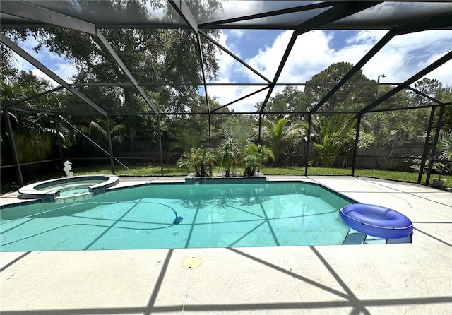 713 Rustic Oaks Dr, Palm Harbor, FL 34684 - view of swimming pool with a patio, a pool with connected hot tub, glass enclosure, and a fenced backyard