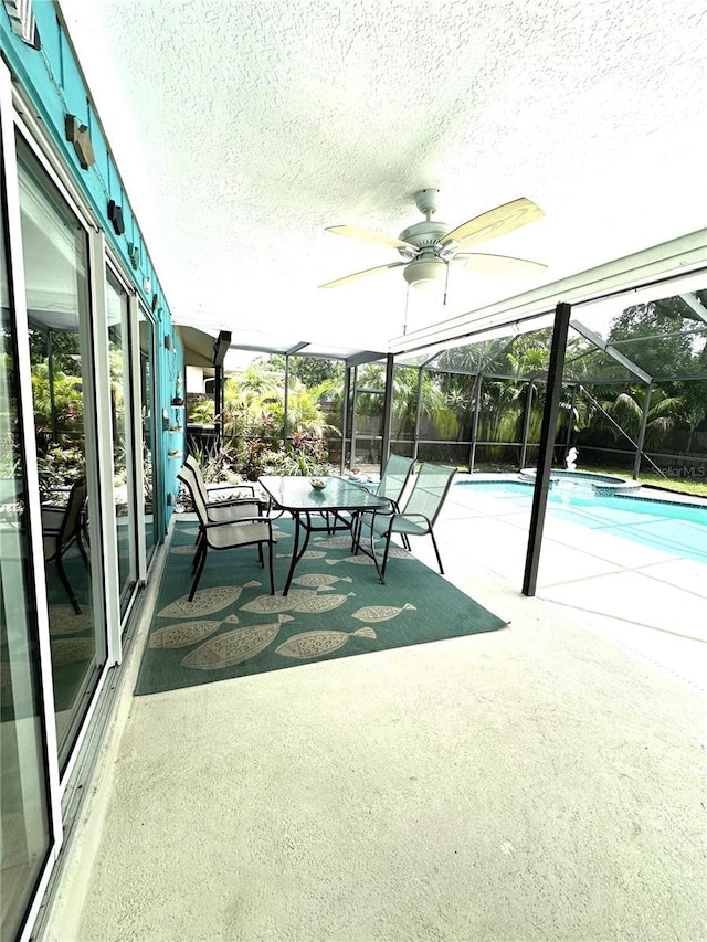 713 Rustic Oaks Dr, Palm Harbor, FL 34684 - unfurnished sunroom featuring a ceiling fan and plenty of natural light