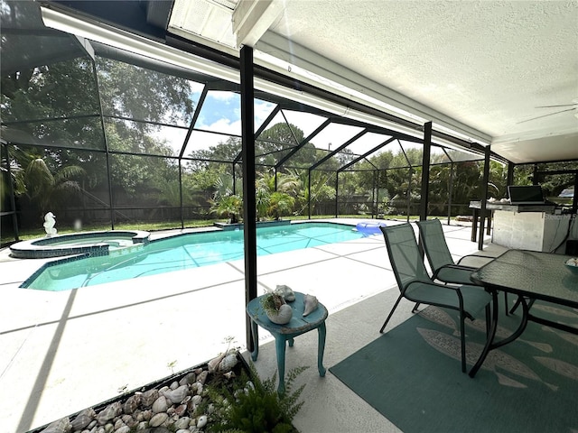 713 Rustic Oaks Dr, Palm Harbor, FL 34684 - view of swimming pool featuring an outdoor kitchen, a patio, a pool with connected hot tub, ceiling fan, and a lanai