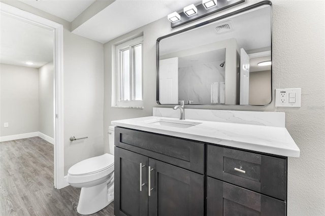 7607 New York Ave, Hudson, FL 34667 - full bathroom featuring wood finished floors, vanity, and a shower