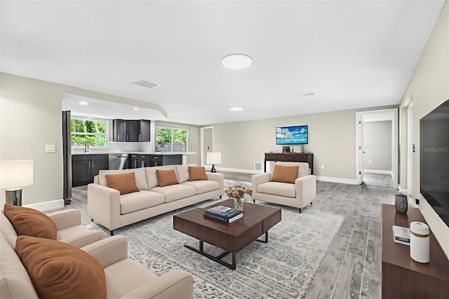 7607 New York Ave, Hudson, FL 34667 - living area with light wood-type flooring and recessed lighting