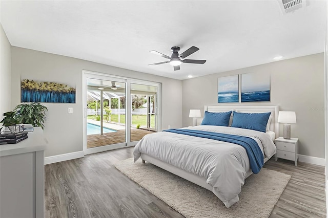 7607 New York Ave, Hudson, FL 34667 - bedroom featuring access to outside, light wood finished floors, and ceiling fan