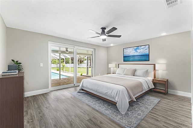 7607 New York Ave, Hudson, FL 34667 - bedroom with access to outside, wood finished floors, and a ceiling fan