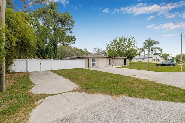 7607 New York Ave, Hudson, FL 34667 - view of yard with a gate and driveway