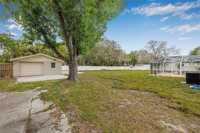 7607 New York Ave, Hudson, FL 34667 - view of yard with a detached garage, a lanai, and driveway