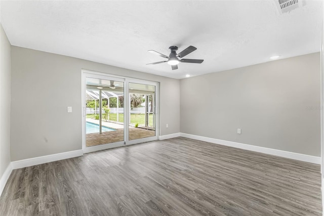 7607 New York Ave, Hudson, FL 34667 - empty room with ceiling fan and wood finished floors