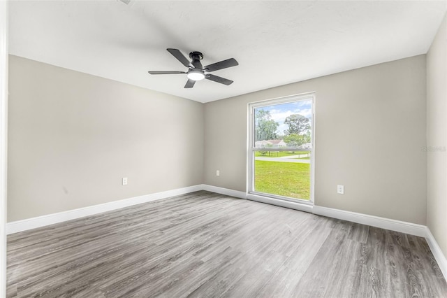 7607 New York Ave, Hudson, FL 34667 - spare room featuring wood finished floors and a ceiling fan