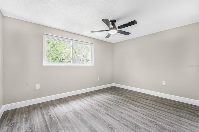 7607 New York Ave, Hudson, FL 34667 - unfurnished room with wood finished floors and ceiling fan