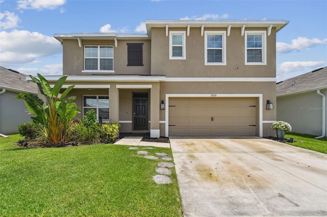 33678 Jasper Stone Dr, Wesley Chapel, FL 33543 - view of front of house featuring stucco siding and a front lawn