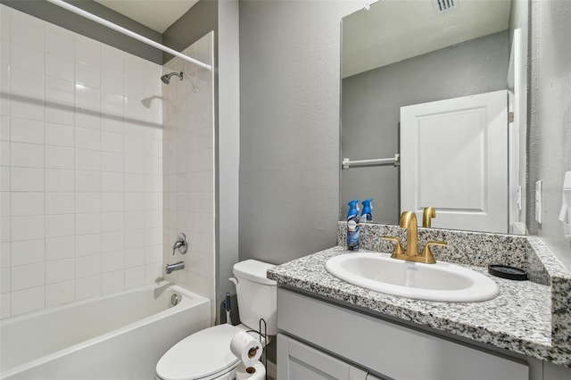 33678 Jasper Stone Dr, Wesley Chapel, FL 33543 - bathroom featuring vanity,  shower combination, and a textured wall