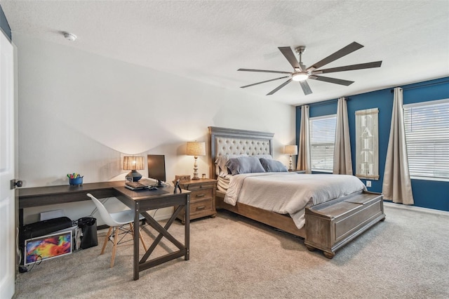 33678 Jasper Stone Dr, Wesley Chapel, FL 33543 - bedroom featuring light carpet, an office area, a textured ceiling, and a ceiling fan