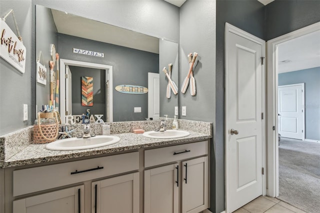33678 Jasper Stone Dr, Wesley Chapel, FL 33543 - bathroom featuring double vanity and tile patterned flooring