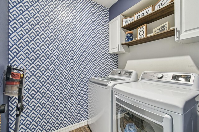 33678 Jasper Stone Dr, Wesley Chapel, FL 33543 - laundry room featuring cabinet space and separate washer and dryer